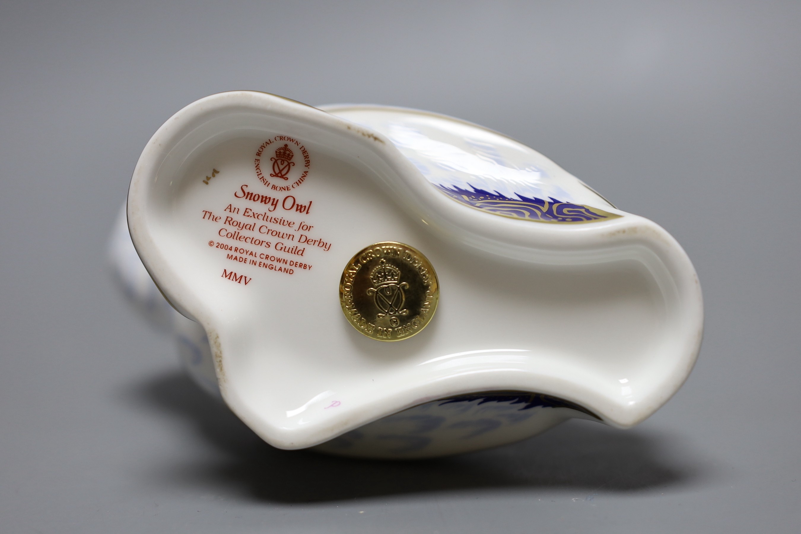 A Royal Crown Derby paperweight - Snowy Owl, gold stopper, boxed, no certificate.